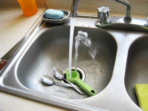 kitchen sink clogged with grease