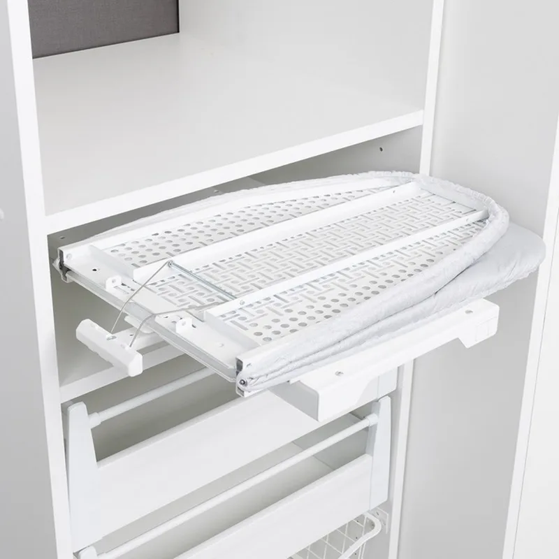 Folding pull out ironing board folded beside cabinet